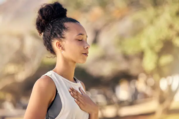 Woman practicing mindfulness outdoors