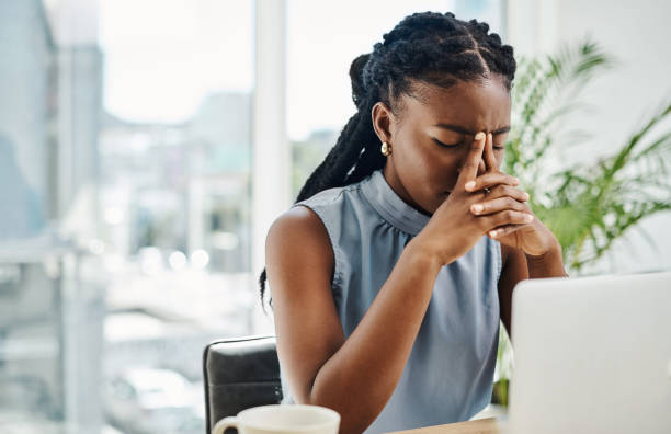 Overwhelmed professional at a crossroads